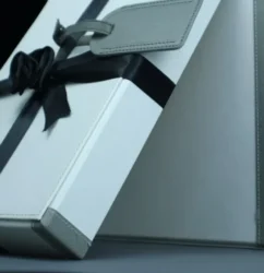 a white gift box dubai with a black ribbon