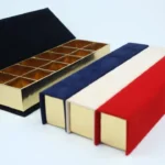 a box with a lid open and a red white and blue box with a red white and blue box with a gold lid