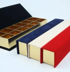 a box with a lid open and a red white and blue box with a red white and blue box with a gold lid