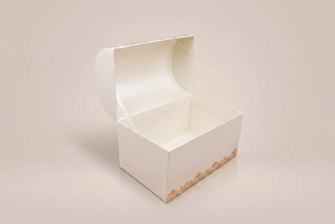 Cream rigid chest gift box with gold pattern, lid open